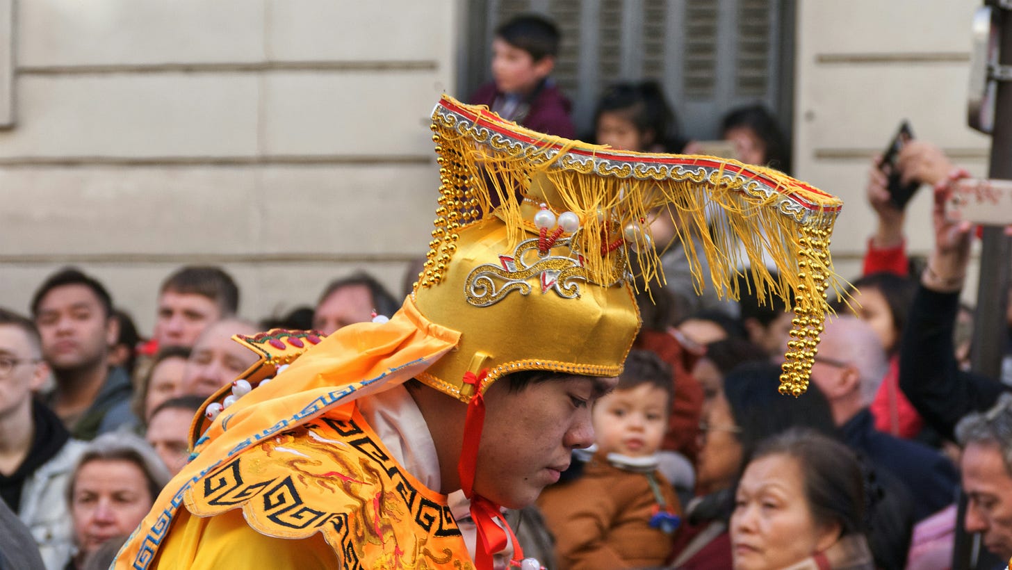 Tibetan lama wearing a gold brocade headdress Tibetan lama wearing a gold brocade headdress