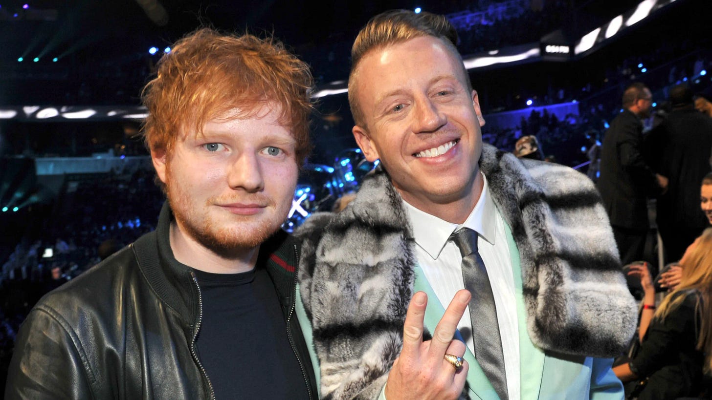 Ed Sheeran and Macklemore posing for a photo at the 2013 MTV Video Music Awards. Ed Sheeran and Macklemore posing for a photo at the 2013 MTV Video Music Awards.