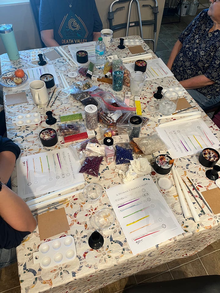 Table with materials and completed candles