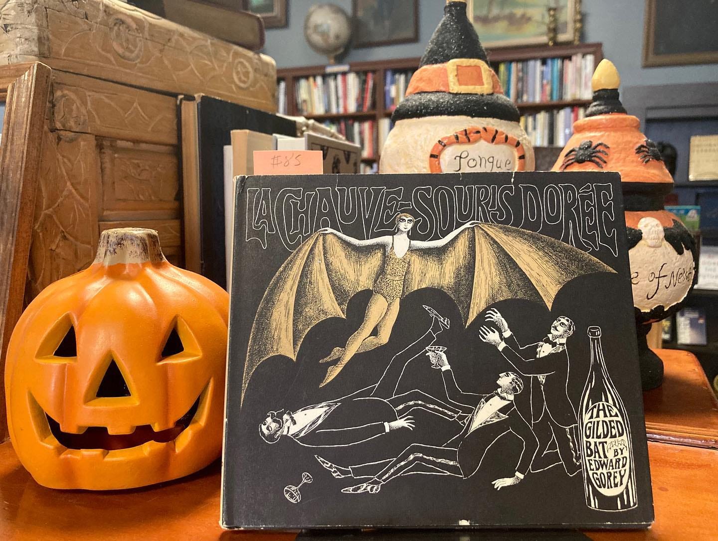 Copy of The Gilded Bat set among Halloween decorations