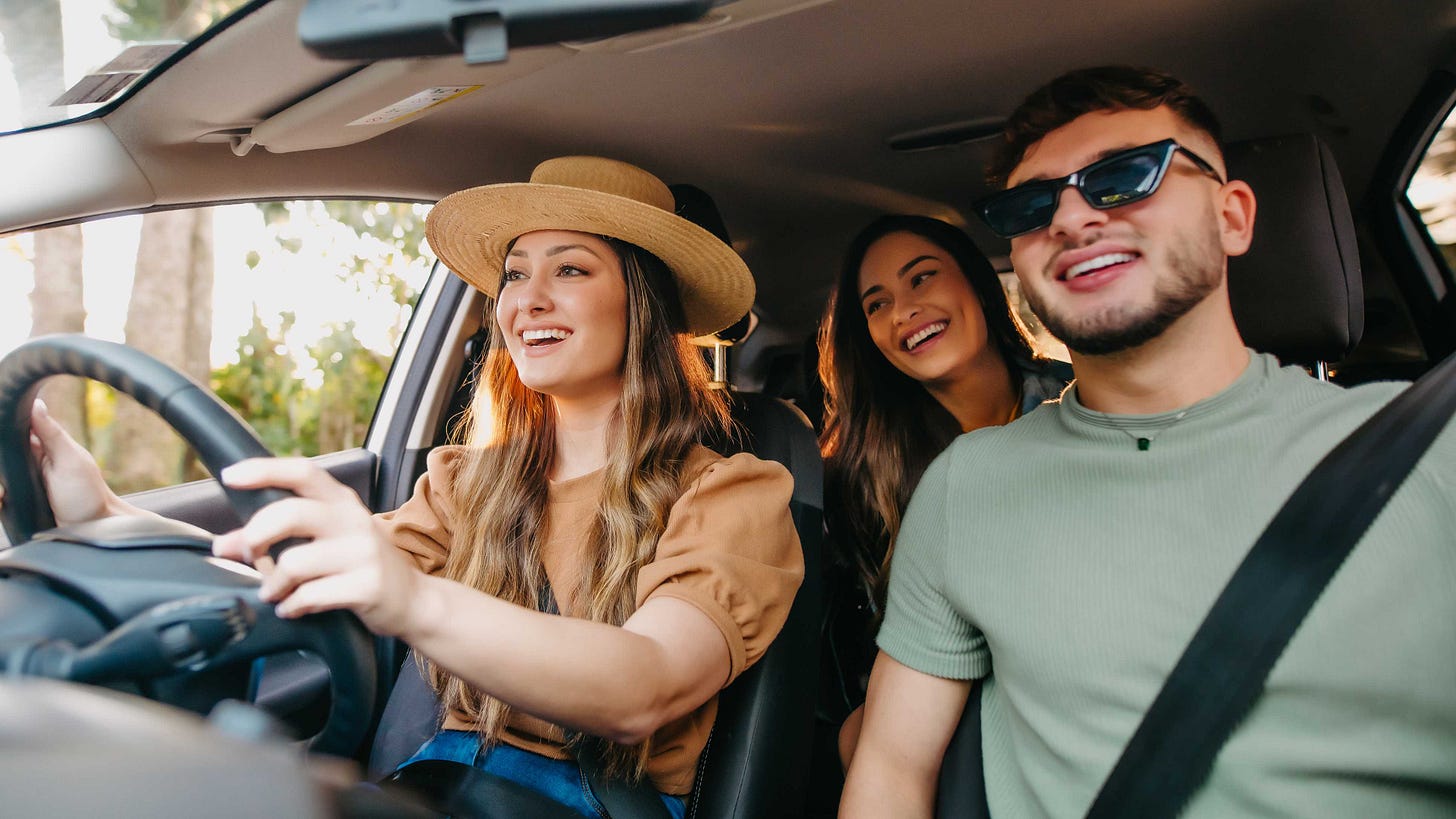 Couple driving a car.