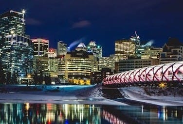 a view of a city at night from across the river