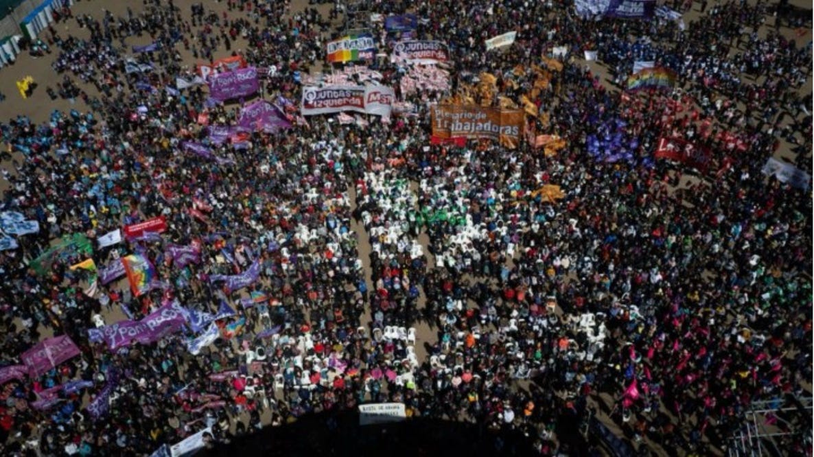 A large crowd of people protesting

AI-generated content may be incorrect.