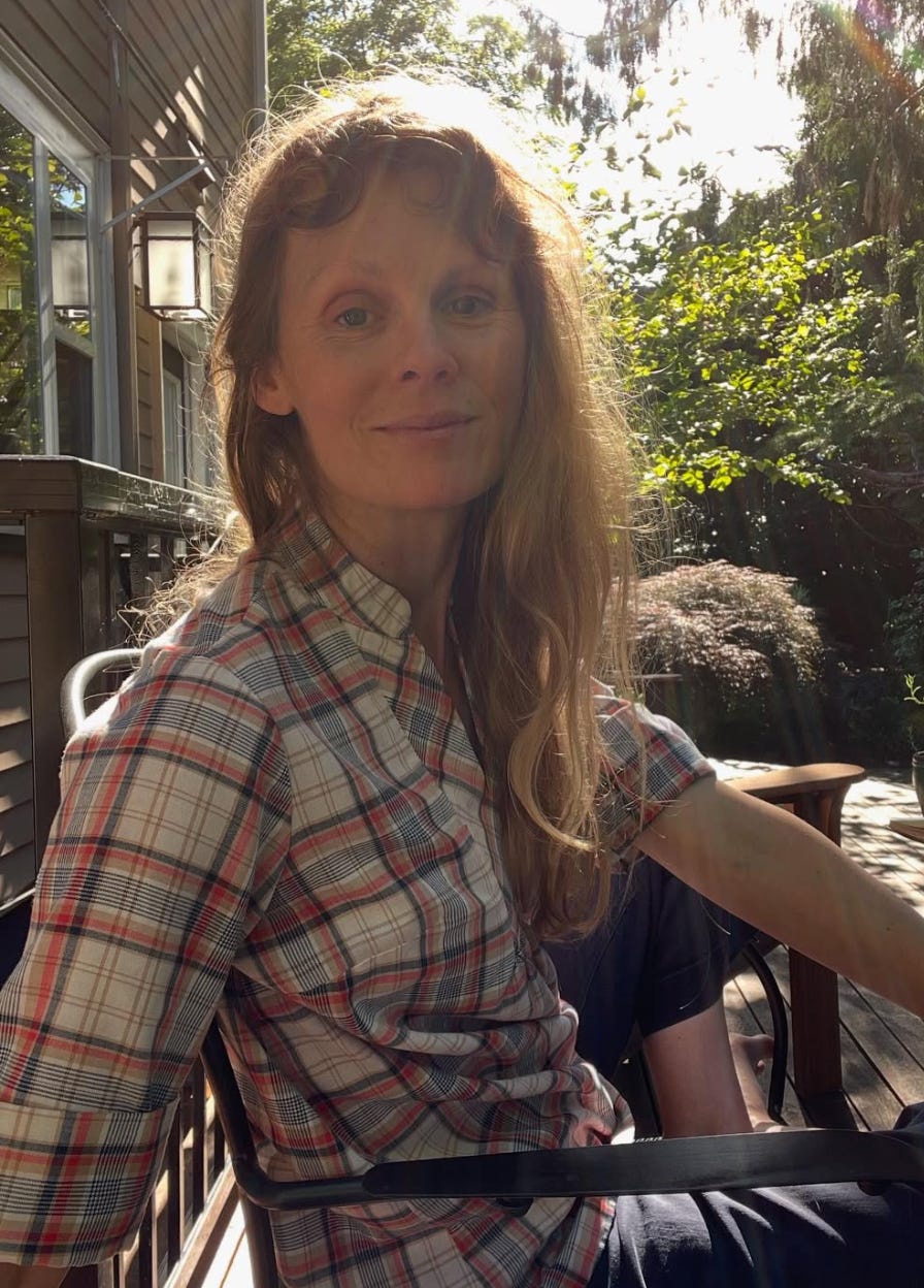 kelly facing camera, backlit by rising sun