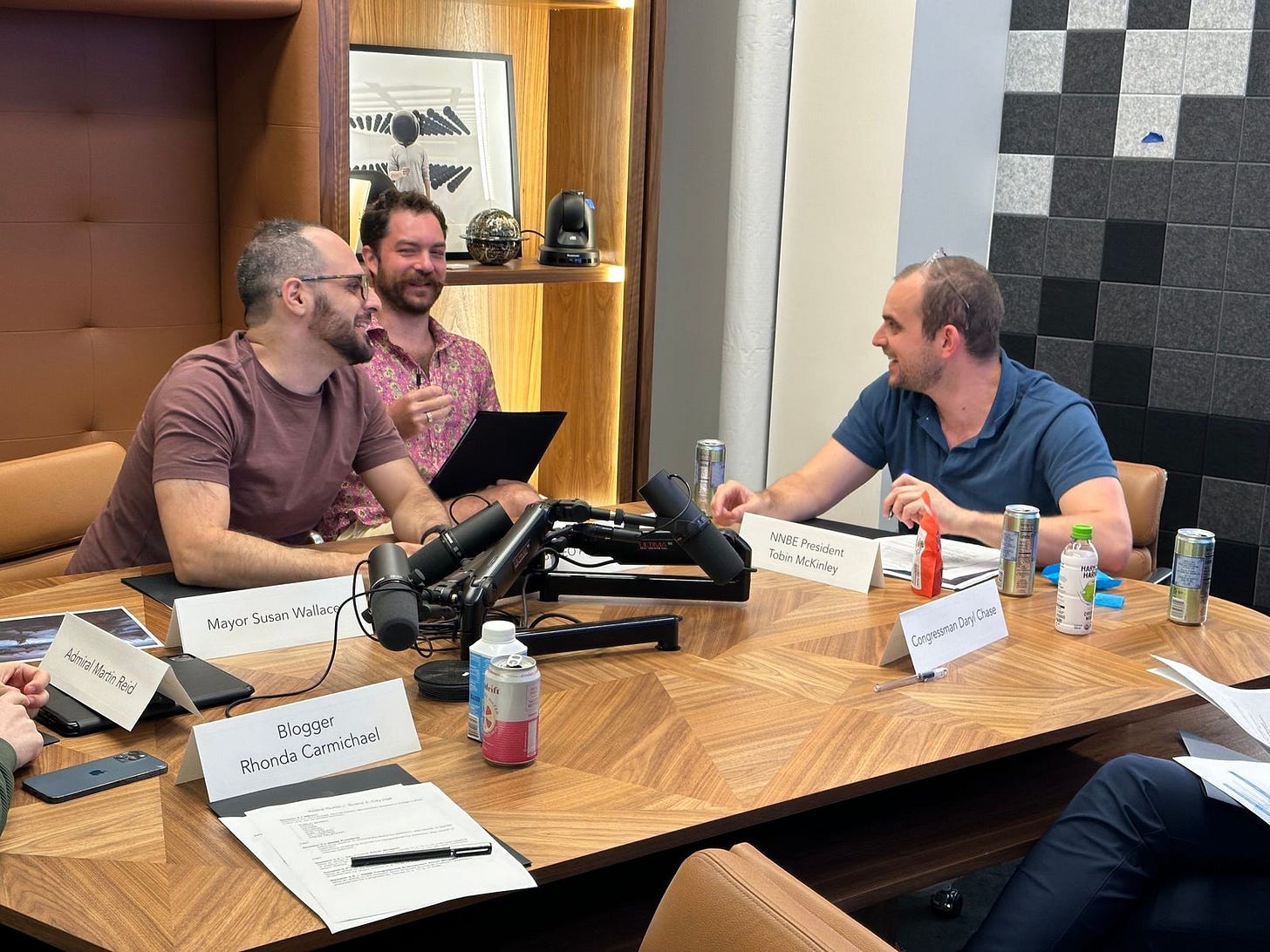 A group of entrepreneurs playing local and federal officials debate the future of America A group of entrepreneurs playing local and federal officials debate the future of America