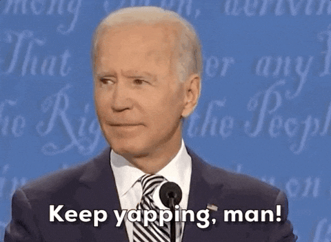 Joe Biden during the 2020 presidential debate, looking to the side and saying, “Keep yapping, man,” with a sarcastic smirk.