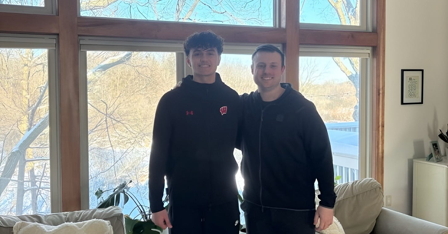 Wisconsin football commit Dustin Roach standing next to safeties coach Jack Cooper.