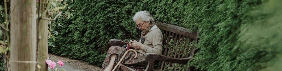 woman sitting on brown bench