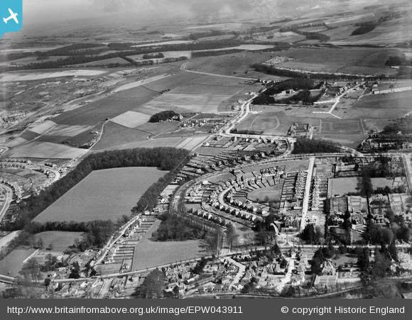 Old black & white view of the area from the air, when the housing was being built around the green.