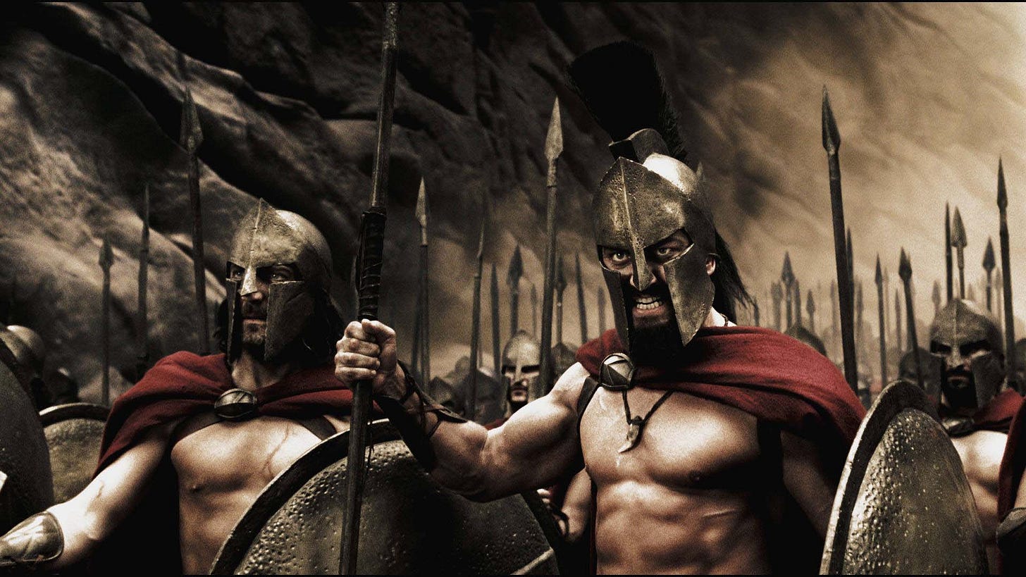 bare-chested helmeted spartans with spears and shields looking fierce bare-chested helmeted spartans with spears and shields looking fierce