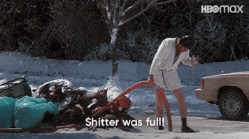 cousin eddie in national lampoon christmas vacation scene in a robe holding tubing into the sewer and saying "shitter was full"