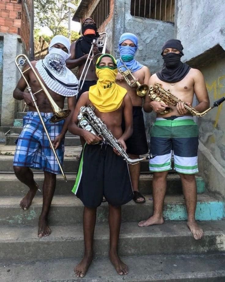 This may contain: some people are standing on the steps with musical instruments in their hands and one is wearing a bandana