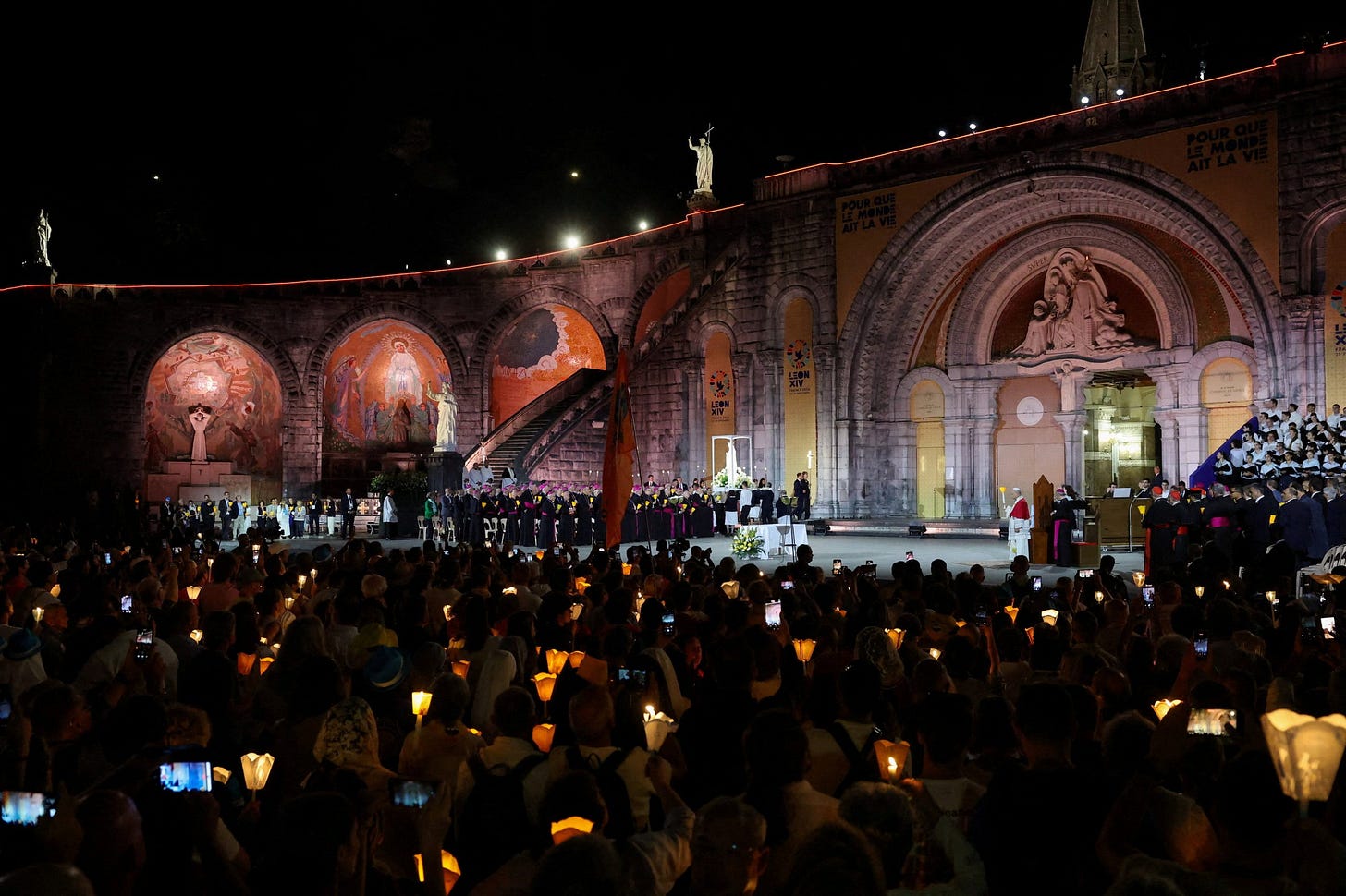 Candlelit crowd before the Rosary Basilica in Lourdes Candlelit crowd before the Rosary Basilica in Lourdes