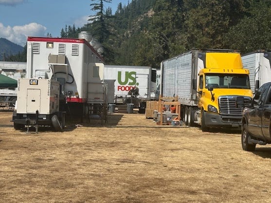 A yellow truck parked in a field

Description automatically generated