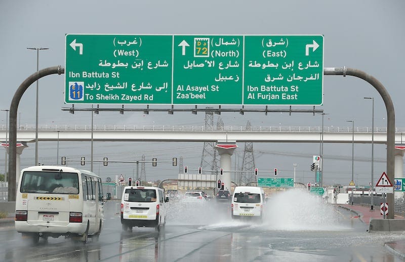Vehicles drive through wet roads around the Discovery Gardens and Al Furjan area in Dubai. Pawan Singh / The National 
