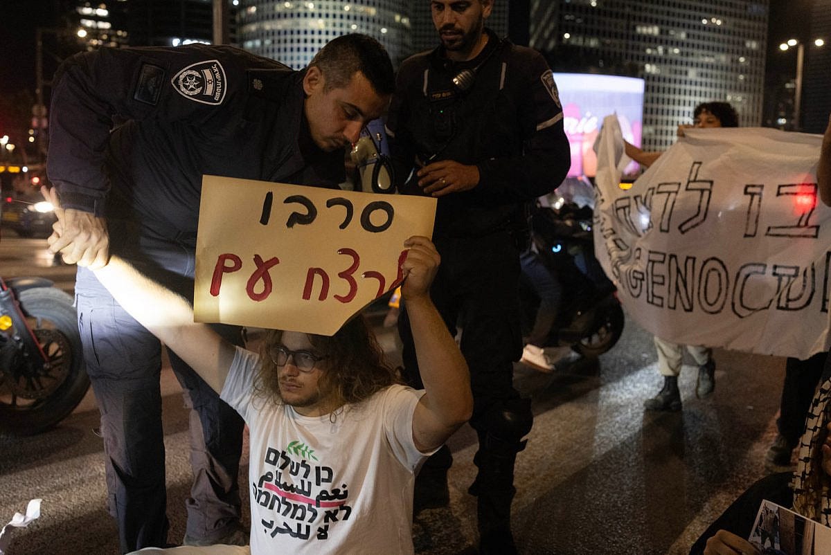 Israeli police officers arrest activist Itamar Greenberg at an anti-war protest in Tel Aviv, May 24, 2025. (Oren Ziv) Israeli police officers arrest activist Itamar Greenberg at an anti-war protest in Tel Aviv, May 24, 2025. (Oren Ziv)