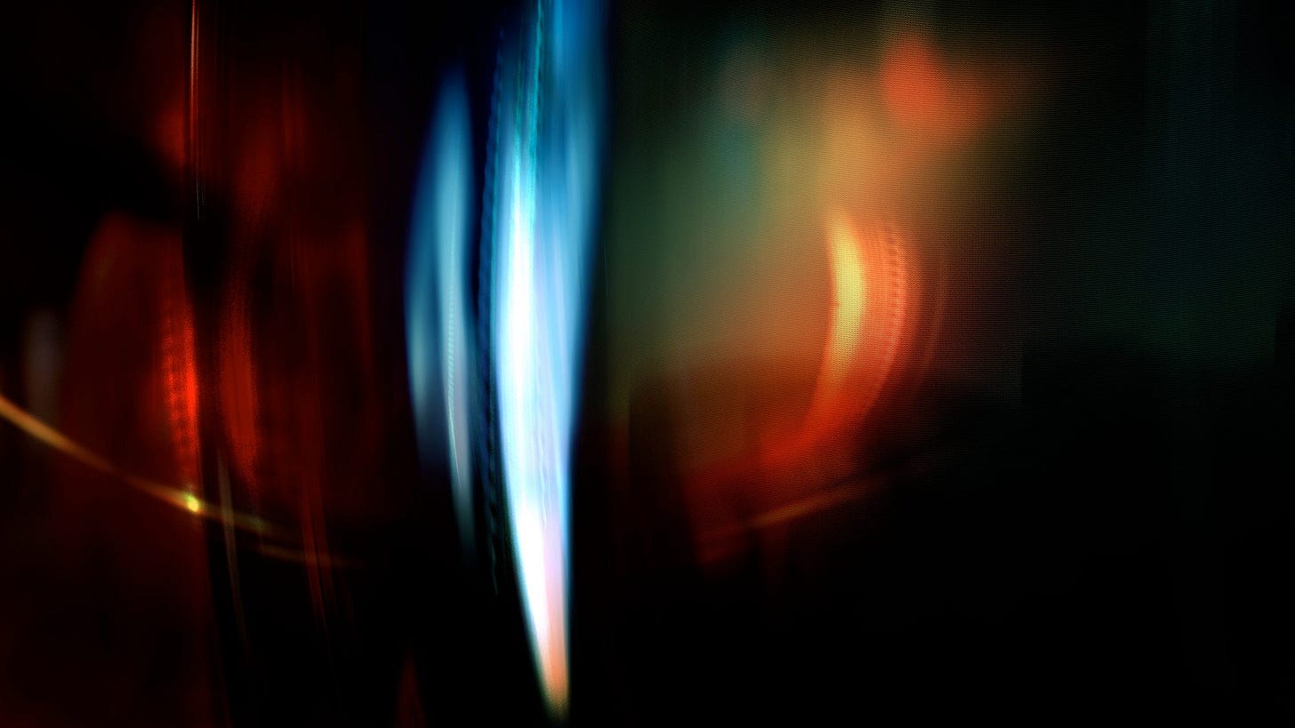 An abstract photo collage of light leaks against a dark, moody background.