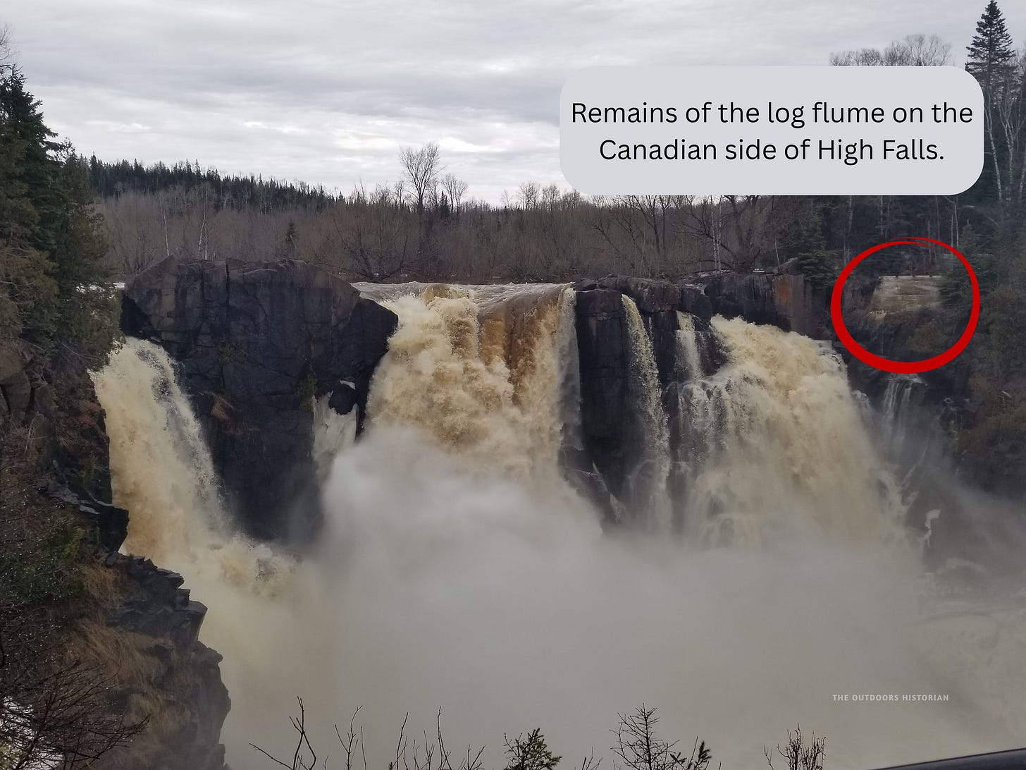 A photo of the Log Slide dune with digital annotations marking where the historical timber chute was located, highlighting the industrial layers of the site.