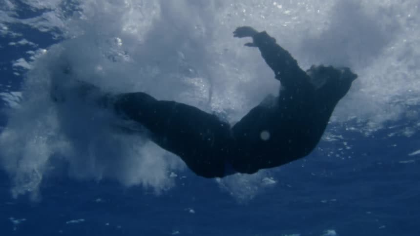 An unresponsive person falling into the ocean