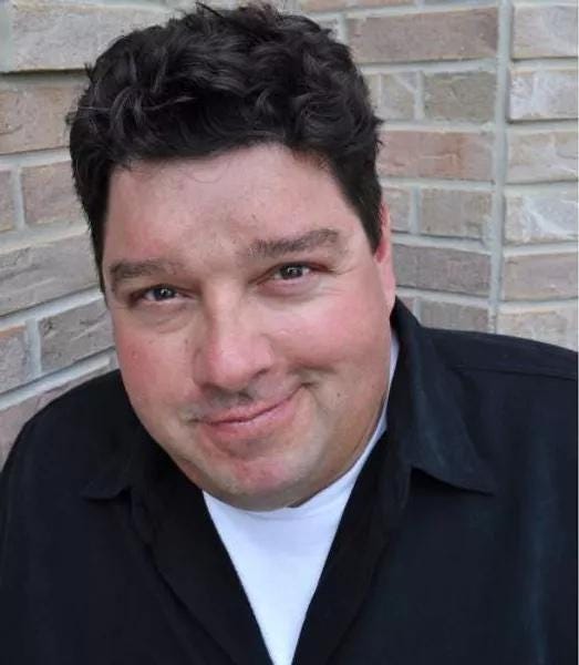 A person in a suit

Description automatically generated with low confidence