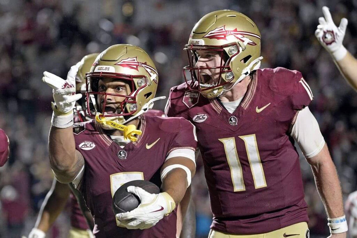 Oct 5, 2024; Tallahassee, Florida, USA; Florida State Seminoles wide receiver Ja&#039;Khi Douglas (0) celebrates with quarterback Brock Glenn (11) after a touchdown against the Clemson Tigers during the second half at Doak S. Campbell Stadium. Mandatory Credit: Melina Myers-Imagn Images