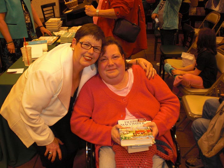 Debi getting a book signed by Debbie Macomber