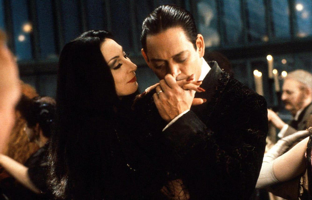 A still of Gomez and Morticia dancing from Addams Family Values