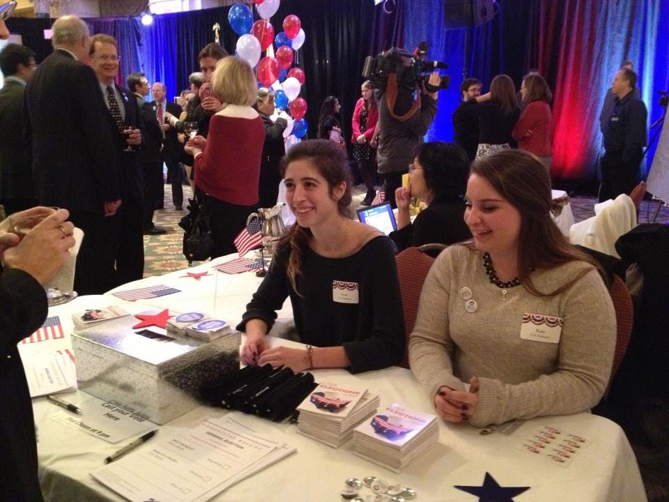 Participants monitor the unofficial 2012 ballot box at the U.S. Embassy in Ottawa, Canada's 2012 Election Night Event at the at the Chateau Laurier in Ottawa, November 6, 2012. [State Department photo/ Public Domain]