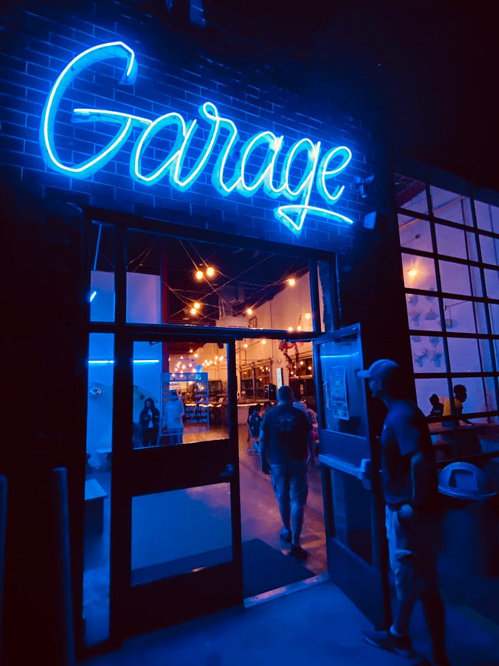 signs, lights, tables, chairs, sky