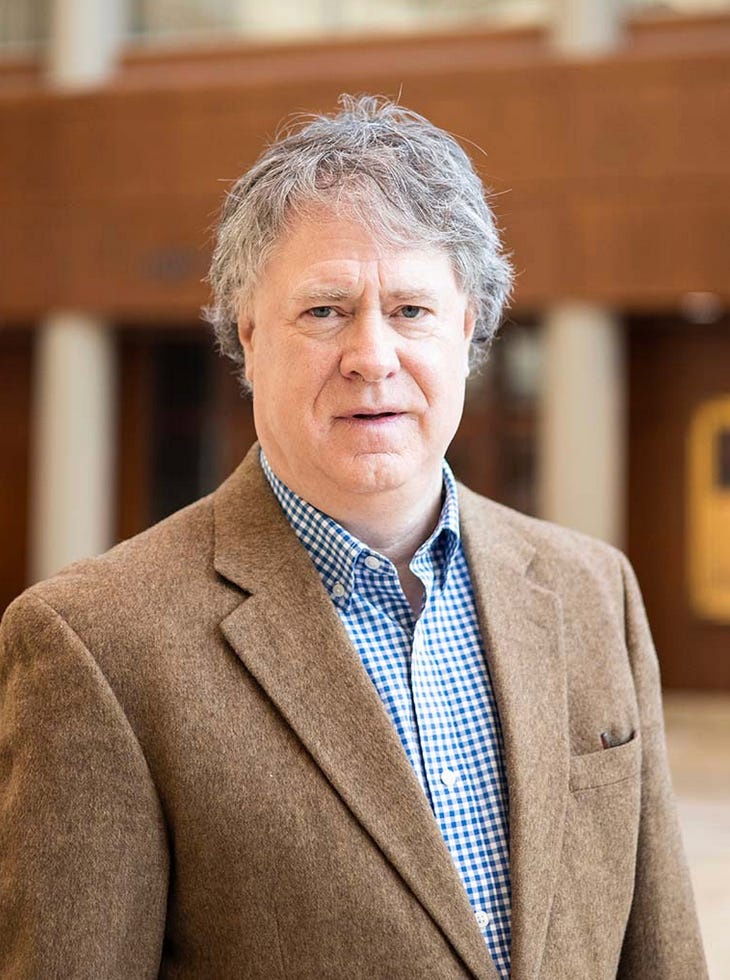 A person in a brown jacket

AI-generated content may be incorrect.