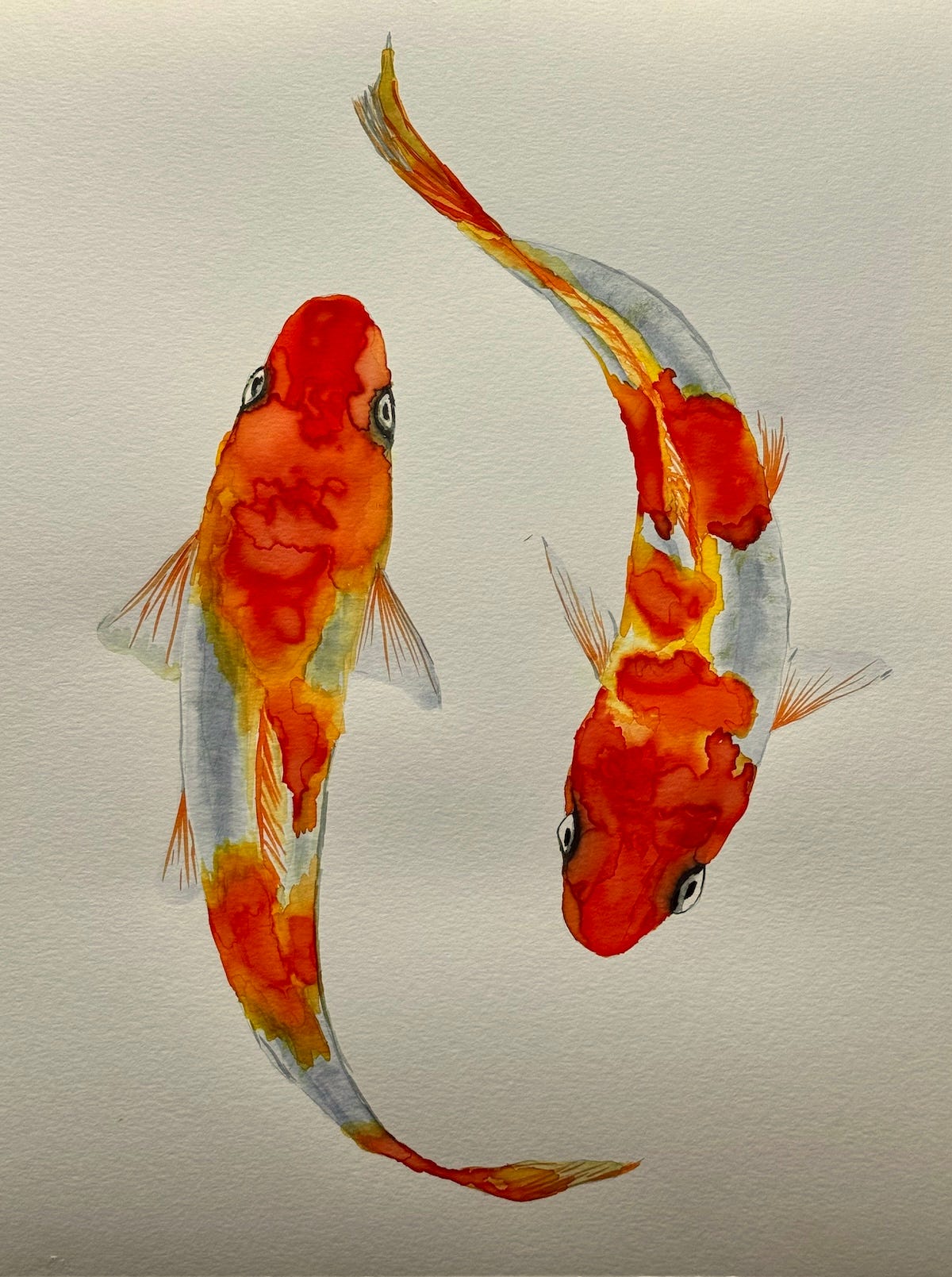 Watercolor painting of two goldfish on a white background