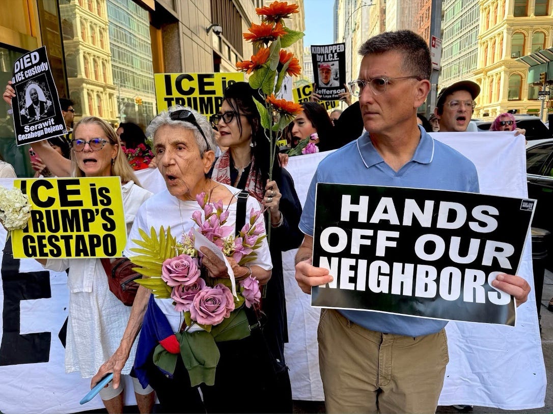 A group of people holding signs

AI-generated content may be incorrect.