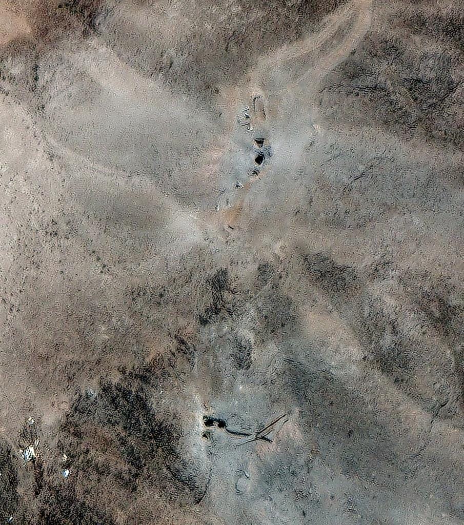 Satellite image of airstrike craters at the Fordow fuel enrichment facility.