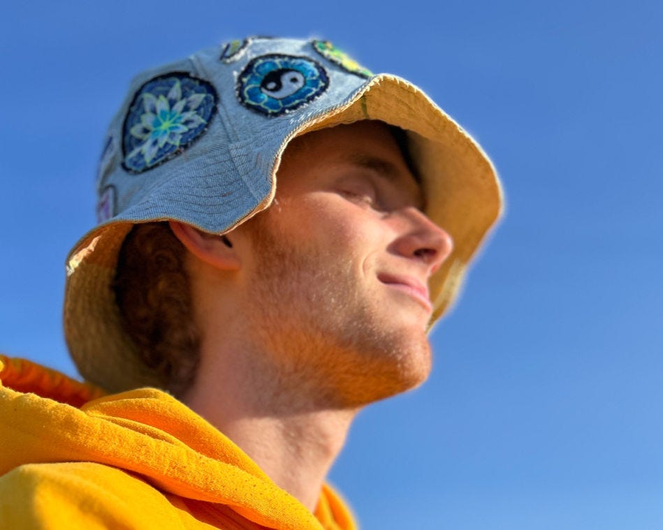 a man smiling with his eyes closed