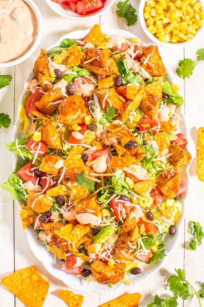 A loaded chicken taco salad on a platter. 