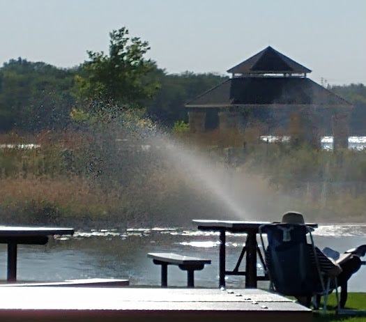 man sitting in a lawnchair watching a sprinkler work (Inkspired community)