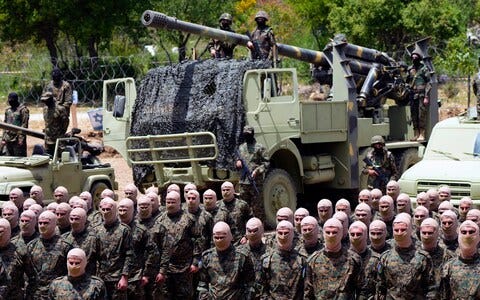 Hezbollah soldiers worry about how other militia groups will be perceived on the front line Hezbollah soldiers worry about how other militia groups will be perceived on the front line