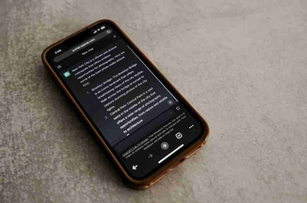 A smartphone rests on a textured surface, displaying text against a dark backdrop. Encased in a brown cover, the screen reveals an ADHD app interface crafted by Julia D’Addurno RP, showcasing a conversation or document designed to support mental well-being.