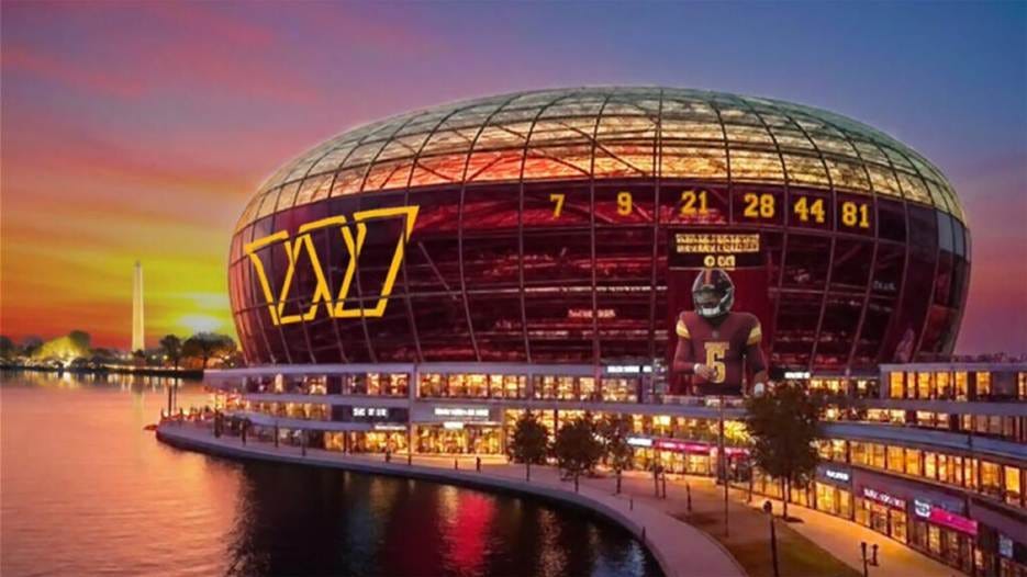 A large round building with a body of water

AI-generated content may be incorrect.