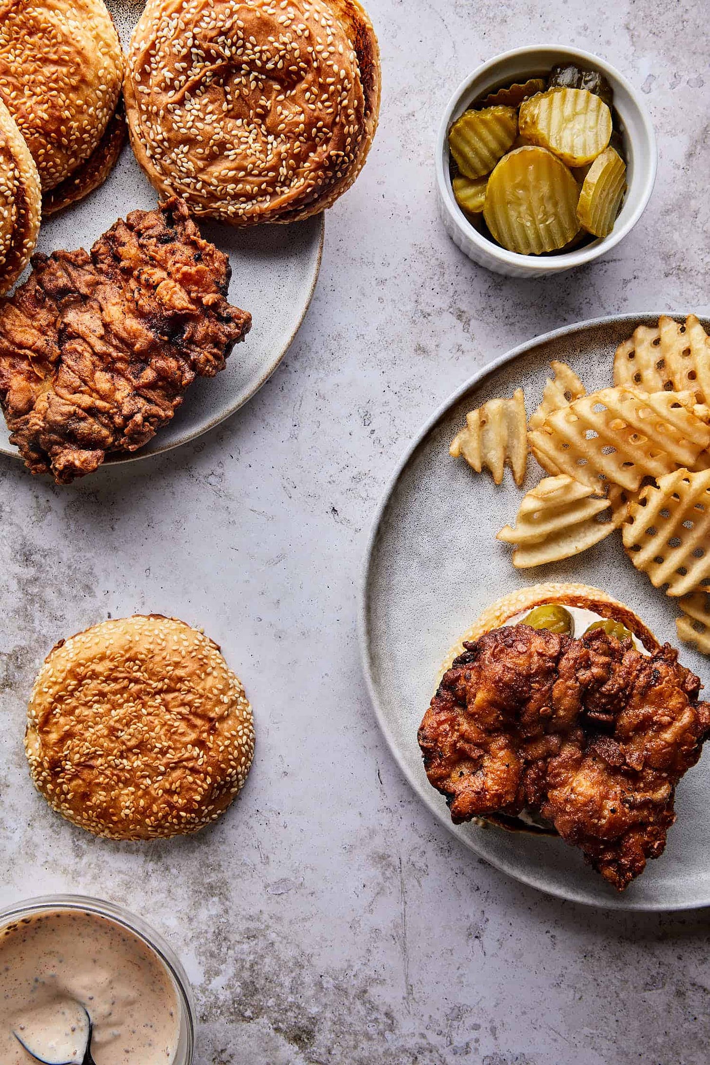 Delicious Toasted brioche buns with pickles, ready to build the best fried chicken sandwich recipe.
Delicious Toasted brioche buns with pickles, ready to build the best fried chicken sandwich recipe.