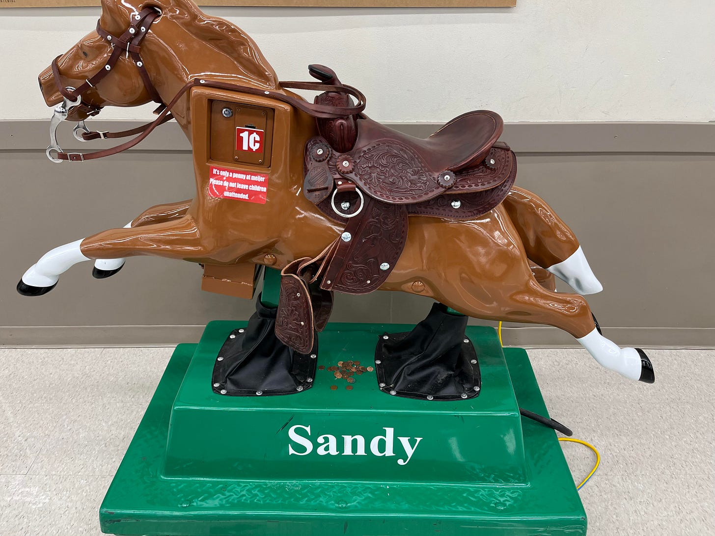 My local Meijer has a pile of pennies so kids can ride Sandy : r/MadeMeSmile