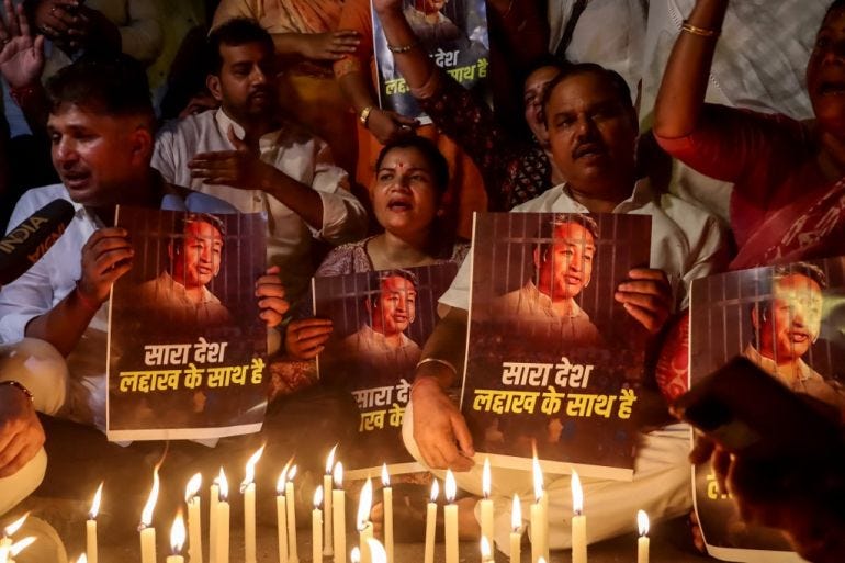 Supporters take part in a candlelight vigil protesting against the arrest of climate activist Sonam Wangchuk, at Jantar Mantar in New Delhi on September 26, 2025. [AFP]
