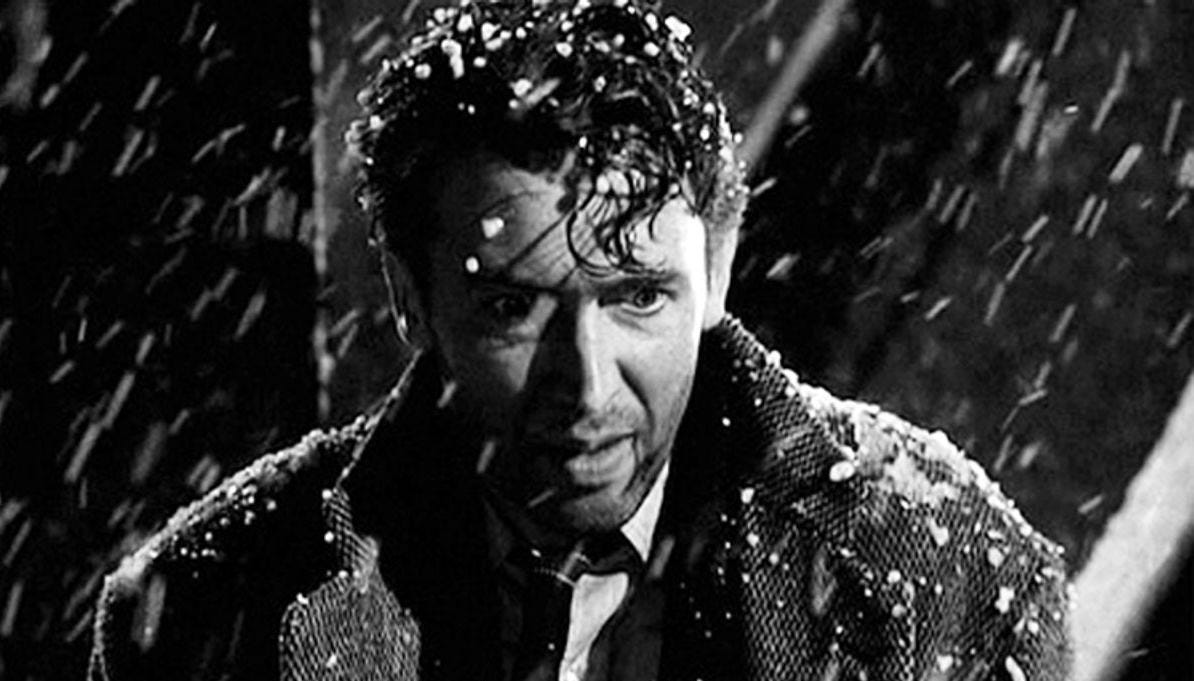 George Bailey stares in blankly on a snowy night.