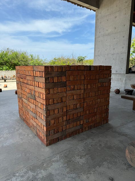 A gallery of images showing art by Bosco Sodi, mostly a collection of concrete and bricks.