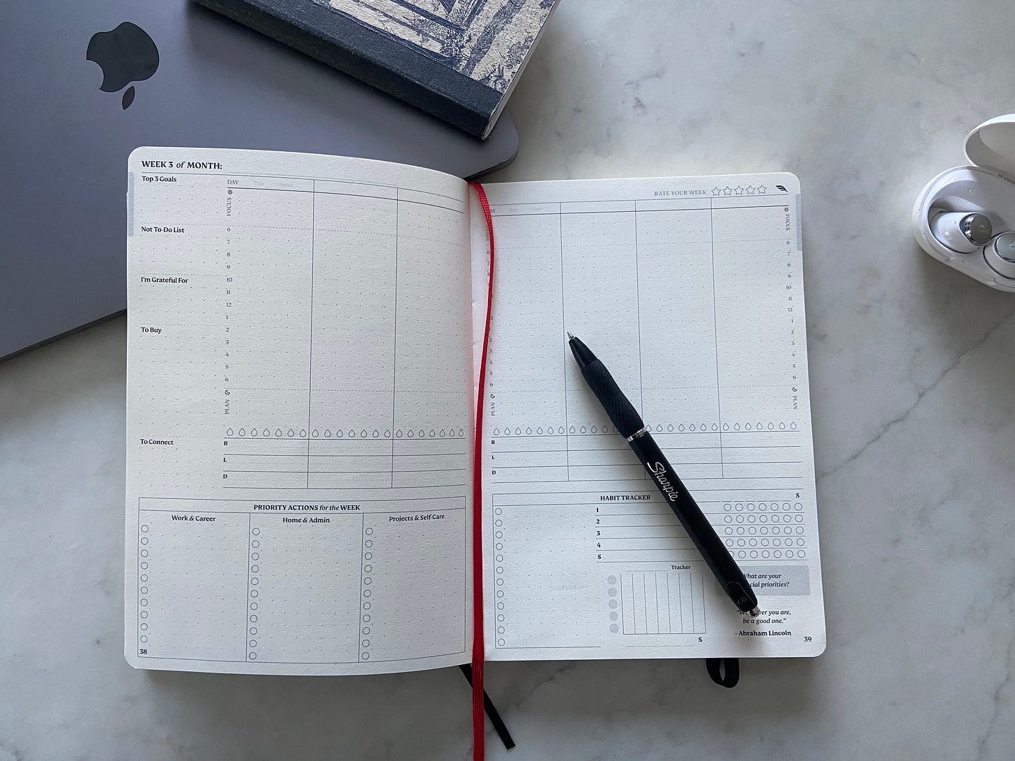 a blank weekly goal planner with pen 