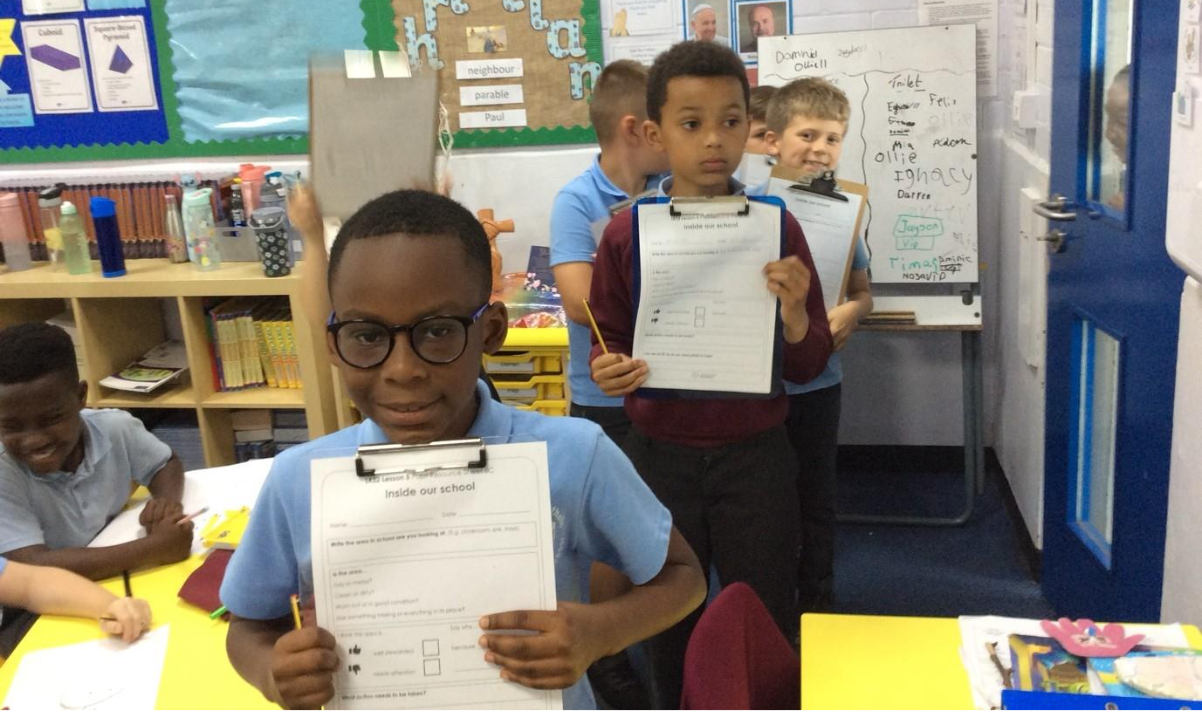 A group of children holding papers

AI-generated content may be incorrect.