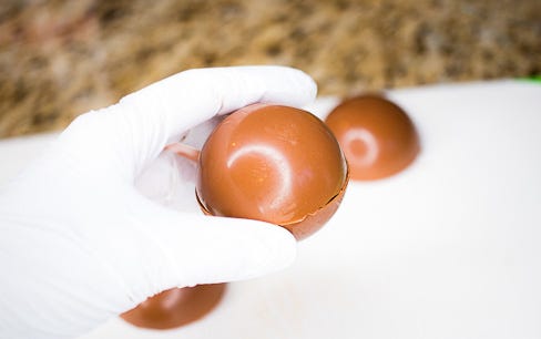 Add top of hot chocolate bomb sphere Add top of hot chocolate bomb sphere