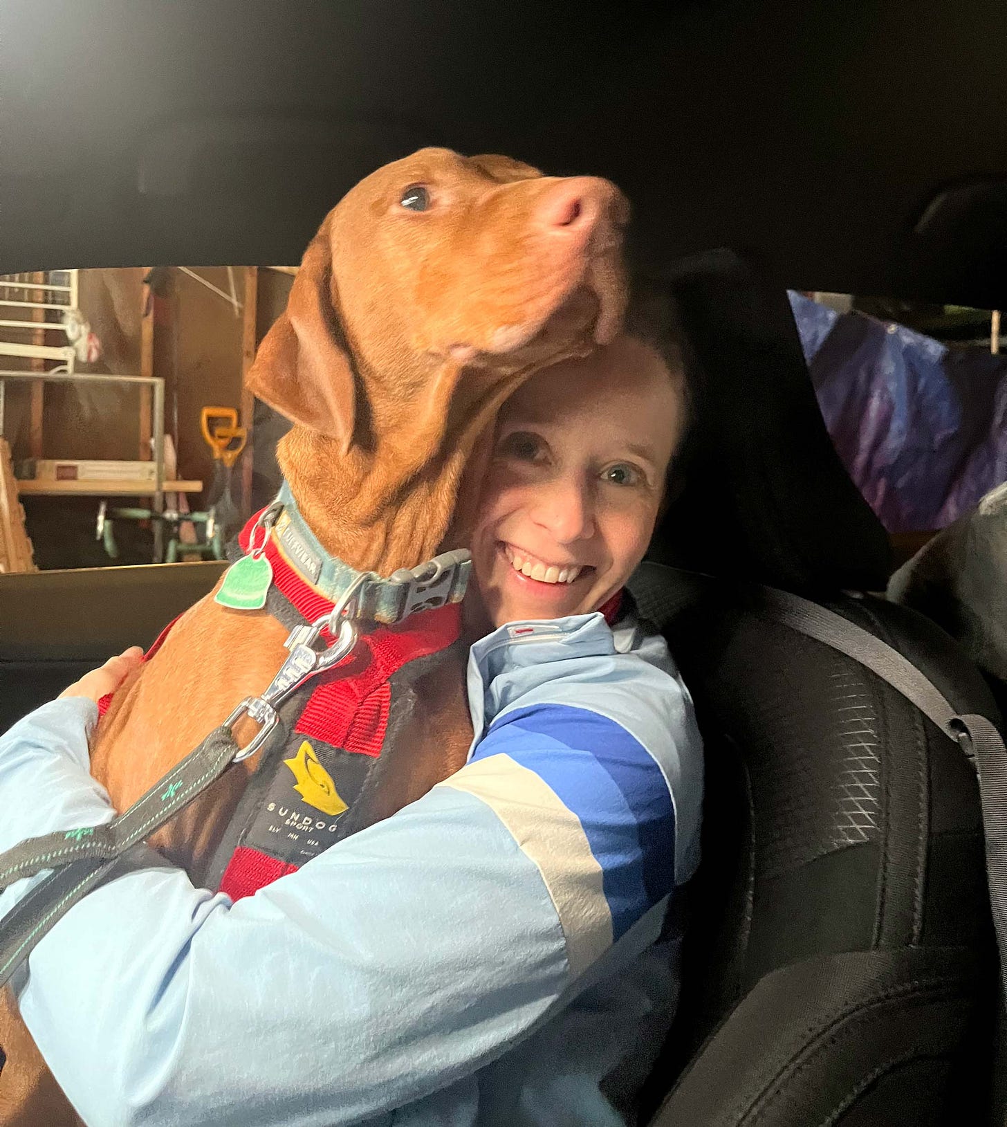 Lief gets hugged by graphic novelist K. Woodman-Maynard as they prepare for a car ride.