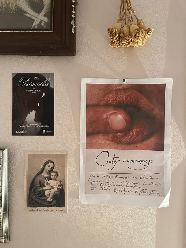 This may contain: a white wall with pictures and other items hanging on it's side, including an eye