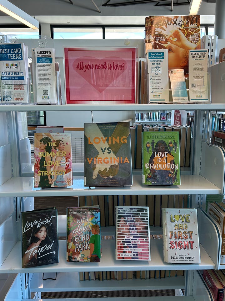 Displays of books including themes like "Black Joy," "Black Future Month," "Graphic Novel Black History Month," "All You Need Is Love?" and "Fighting Together Is Greater Than Fighting Each Other"
